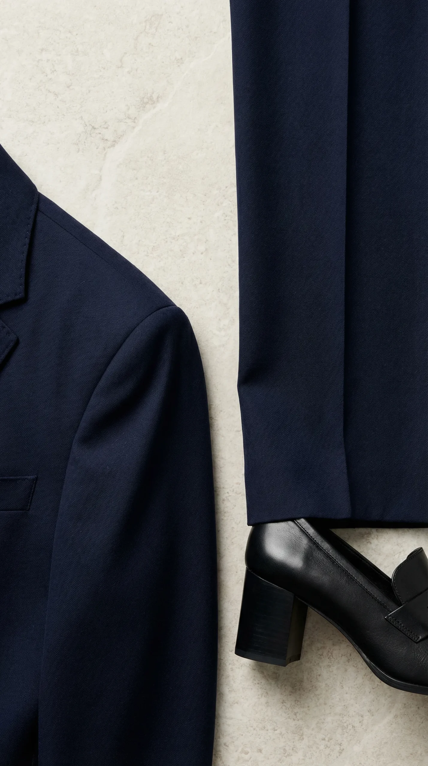 Close-up of tailoring details on a women's business formal suit